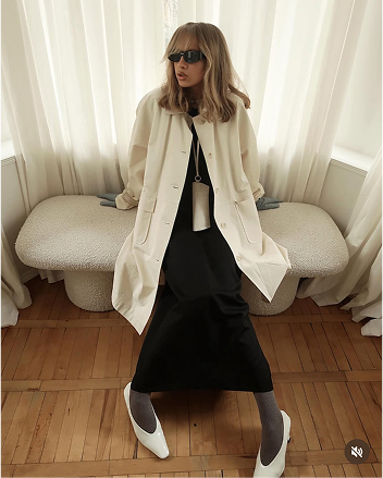 Элегантная женщина в белом блейзере